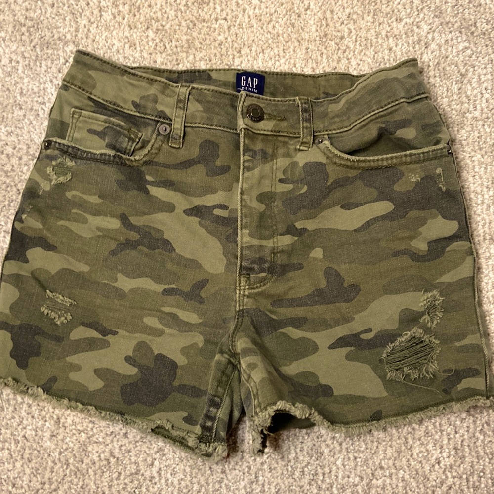 Girls Green camo denim shorts.